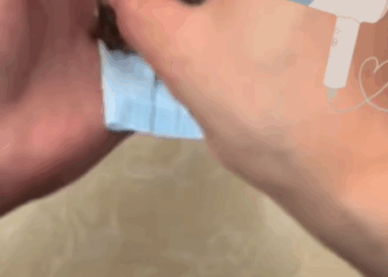 T0307029 girl rescues ducks from pile of shells left near poultry compan part2